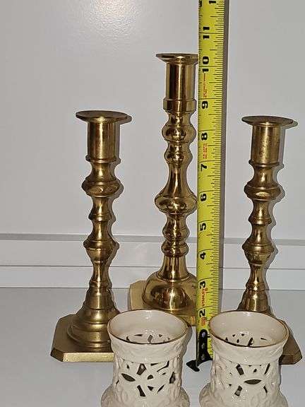 Three brass candlesticks and two Lenox tea lights