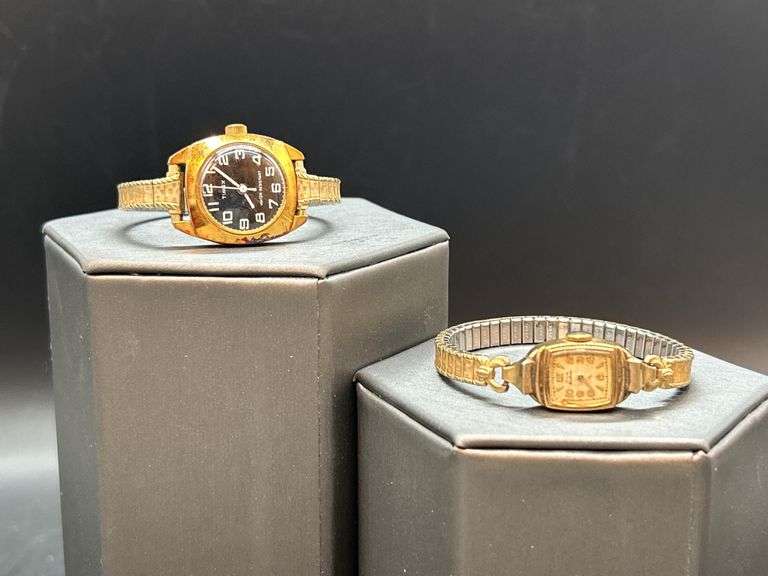 2 vintage ladies watches with stretchy bands…..top is by Timex and lower is 10K gold filled by Elgin and needs hands repaired