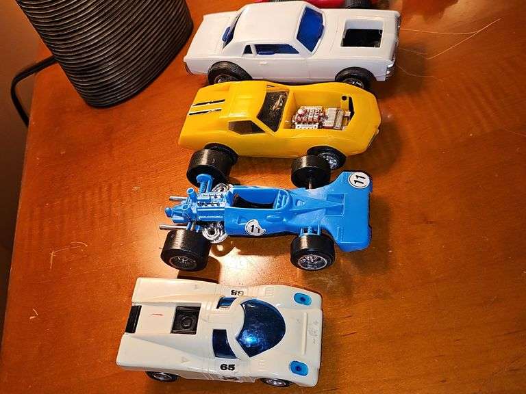 Toy vehicle grouping. Larger vehicles in the back are plastic, planes and General Lee cars or metal diecast.