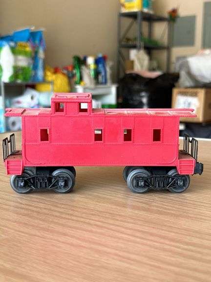 Lionel Trains Red Plastic Caboose…..needs cleaned from being stored in attic