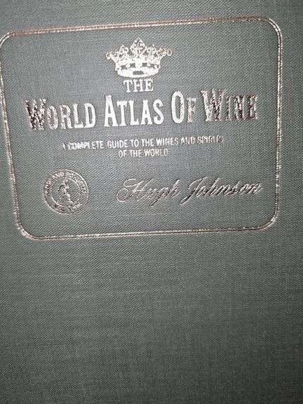 Three totally unrelated books. Sports Century by ESPN, the Lionel Fastrak book, and the world Atlas of wine.