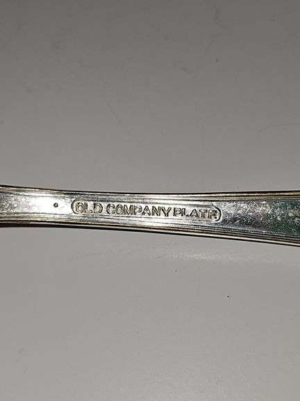 Old company plate flatware possibly Signature Rose pattern. Four dinner forks, four salad forks, five soup spoons, four iced teaspoons, four dinner knives, two serving spoons, one ladle, one cold meat fork, one sugar spoon, and one butter knife. No monogram.  Circa 1940s