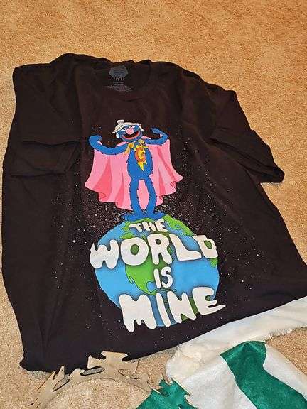 Miscellaneous grouping. Super Grover t-shirt,pink apron, Mardi gras style masks, beads, polar bear hat, and more.
