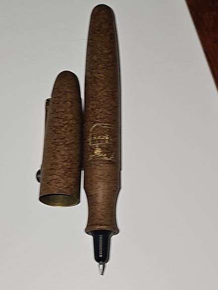 Two Sir Winston wood cigar boxes, cigar pen, and The Cigar Companion hardback book with dust cover.