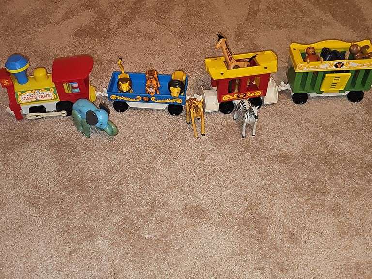 Fisher Price Little people playsets as shown. See all photos. Some pieces have some melting from attic storage as seen on elephant in last photo.