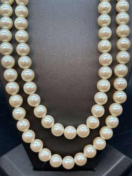 Nice looking double strand of pearl-like beads with adjustable fastener