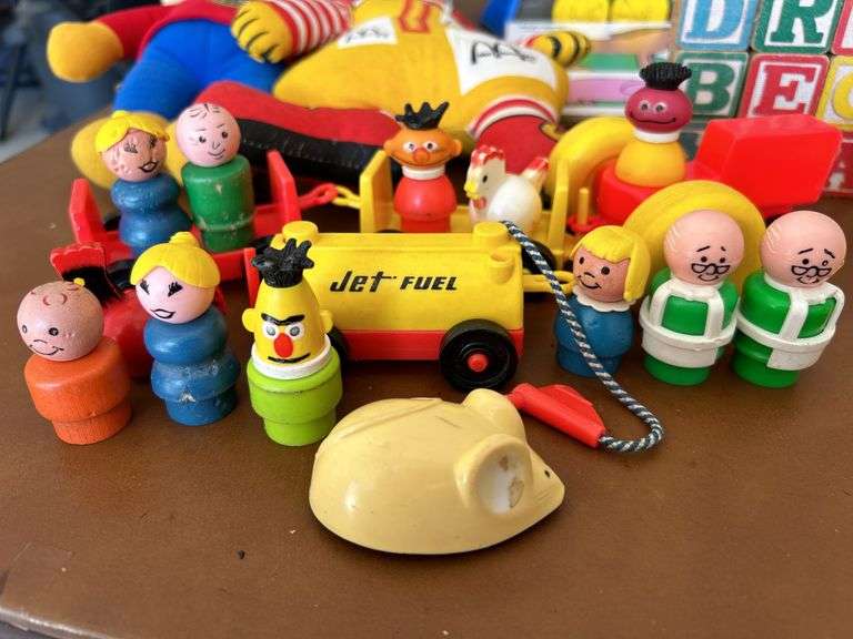 Table full of vintage toys…..Tuggy Tooter does still work, wooden puzzles, Jack-In-The-Box turns but no music nor does he pop out, wooden blocks and more