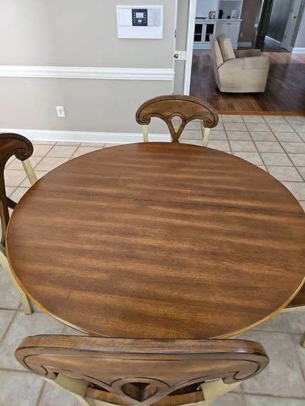 Pier 1 imports table and four chairs. Includes 18 inch leaf. Table is 47.5 x 30.5 in tall. Chairs are 18x 17.5x 39 in tall. Seat height is 18 in.
