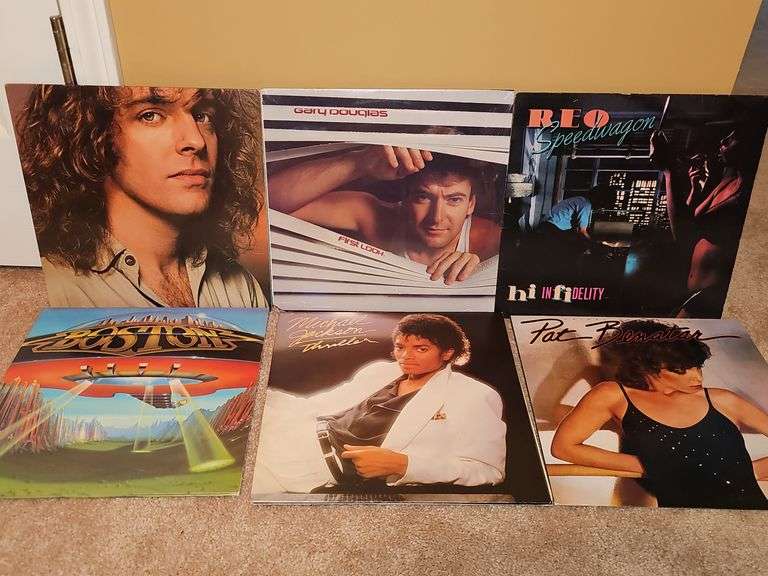 Grouping of albums by Michael Jackson, Pat Benatar, Boston, REO Speedwagon, Gary Douglas, and Peter Frampton.