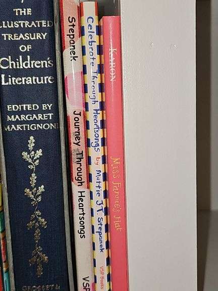 Grouping of children's books and a Bible verse.