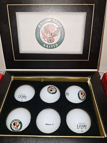 Grouping of golf balls. All boxes are full. Spalding, Titleist, and briarcrest saints.