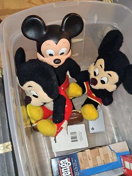 Three vintage Mickey mouse characters, board game Clue, miniature air hockey game untested,  poker chips and cards, and Jenga.