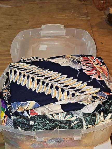 Small container of Hawaiian leis and shirts.