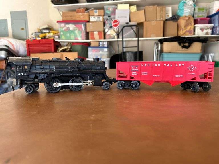 Selection of (2) Lionel Train pieces…..242 Steam Engine (with damage) and Lehigh Valley (L.V. 25000) red rail car