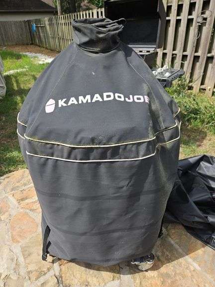 Red Kamado Joe Grill on rollaround iron stand w/cover and some like new accessories...