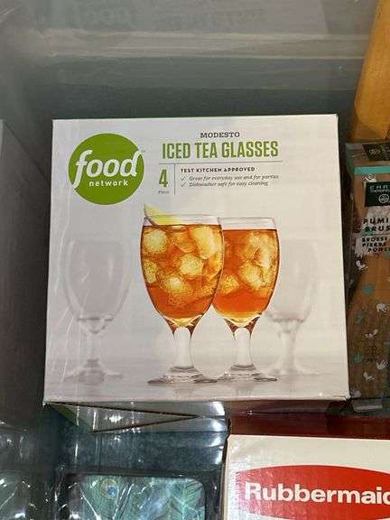 Tote full of miscellaneous household/kitchen items…..Food Network stemware, partial box of Rubbermaid storage containers, cutting boards and more