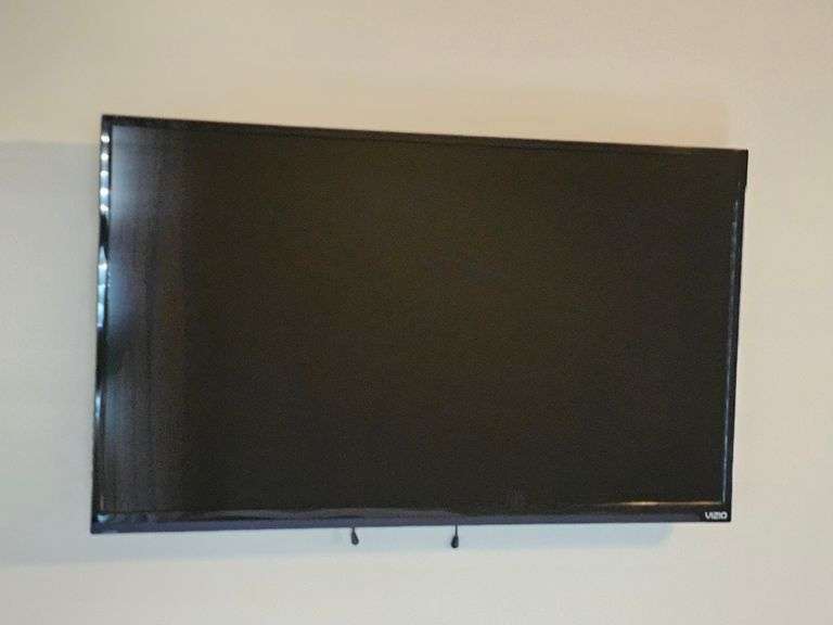 Vizio 38-in flat screen TV with remote. Does not include mount. Turns on, no cable connection.