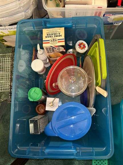 Tote full of miscellaneous household/kitchen items…..2 teal pitchers (acrylic and heavy plastic, collapsible strainer, splatter screen and more
