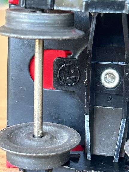 Lionel Trains Red Plastic Caboose…..needs cleaned from being stored in attic