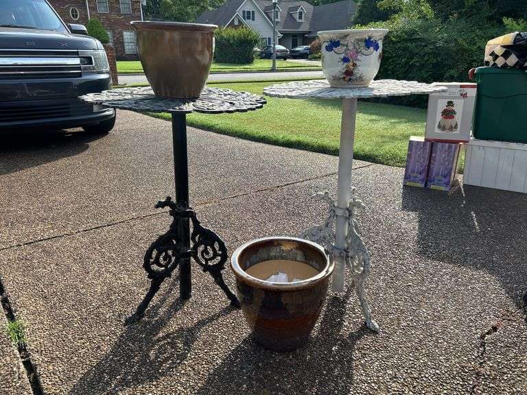 Pair of wrought iron plant stands…..21-1-2”D x 27 & 28-1/2 tall…..both are in used condition and need TLC….also included are 3 various size ceramic planters