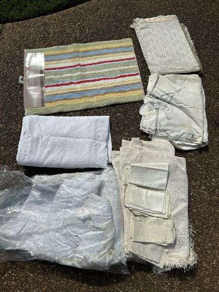 Wide variety of table linens and 1 new bath rug…..sizes unknown