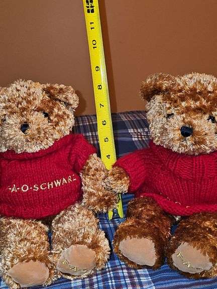 Two FAO Schwartz bears and a TY Beanie Buddy dog.