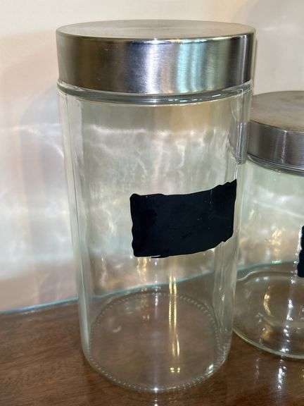 Set of (3) glass and stainless storage jars and (1) all stainless…..heights range from 9” down to 5”