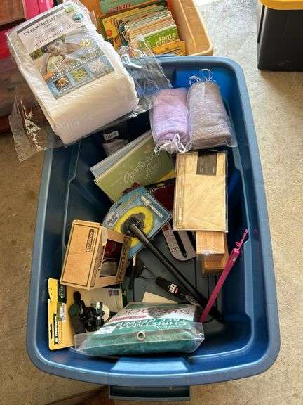 31 gallon tote and contents…..NEW King Size mattress protector, SubZero bottles, NEW kitchen gadgets and much more (no lid for tote)