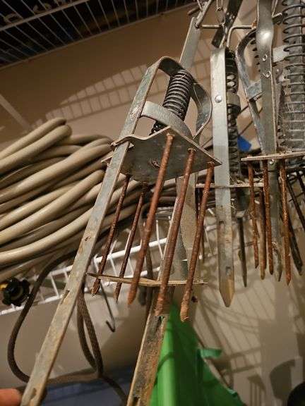 Five plunger type mole traps.