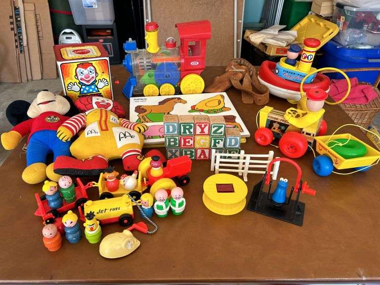 Table full of vintage toys…..Tuggy Tooter does still work, wooden puzzles, Jack-In-The-Box turns but no music nor does he pop out, wooden blocks and more