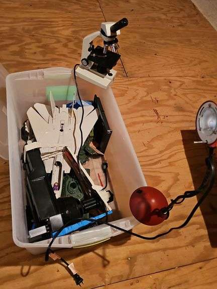 Tub of Star wars, microscope, and desk light.