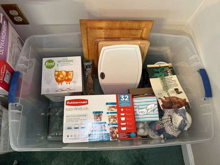 Tote full of miscellaneous household/kitchen items…..Food Network stemware, partial box of Rubbermaid storage containers, cutting boards and more
