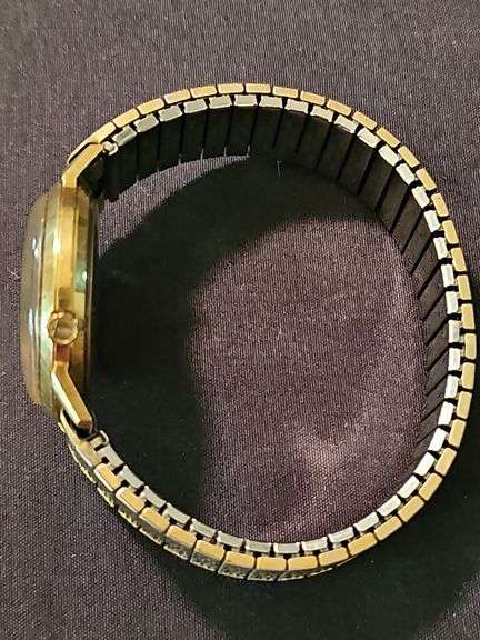 Men's Bulova watch with 14 karat gold case. Watch is not working.