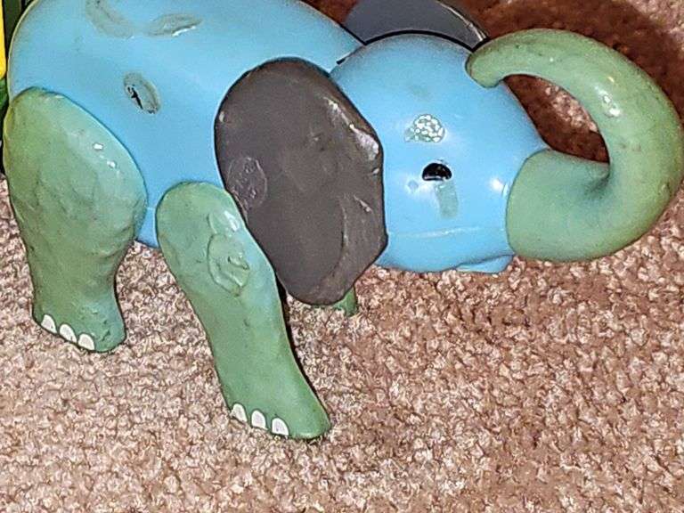 Fisher Price Little people playsets as shown. See all photos. Some pieces have some melting from attic storage as seen on elephant in last photo.