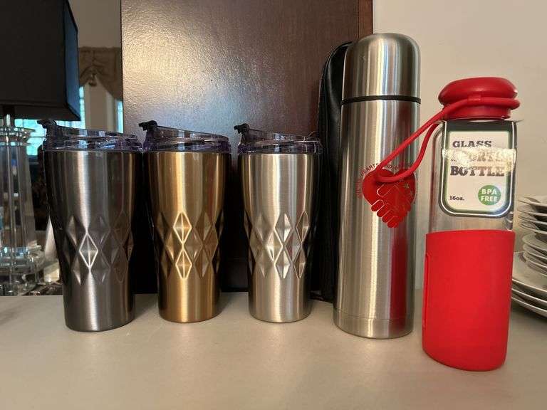 Selection of insulated drink containers and (1) glass sports bottle…..all are NEW and far right silver piece has a dent in the top and comes with carry case (see all pics as more were added) cups are by Primula
