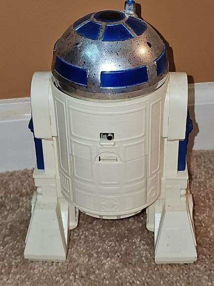 R2-D2 radio controlled robot With remote. Needs three 9 volt batteries. Untested
