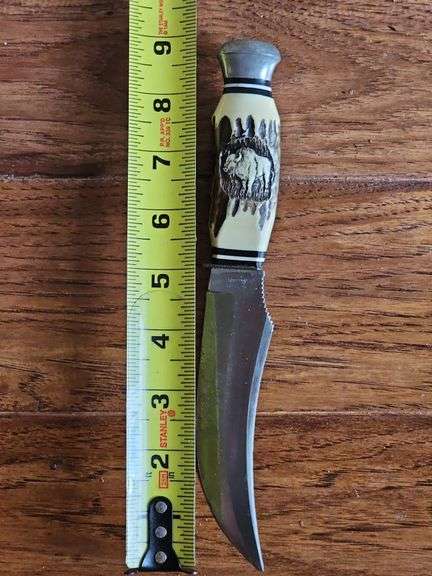 Original Buffalo Skinner knife from Silver Springs Florida with imitation bone handle and leather sheath.