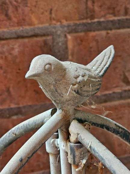 Metal folding trestle with bird finial. 45 in tall