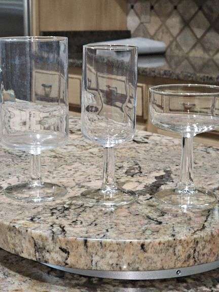 Cabinet of stemware. Matching set of 11 iced beverages, 11 wine glasses, 12 coupe champagne glasses. Matching set of 8 "H" monogrammed glasses, four shrimp cocktail stems with liners and more. See all photos.