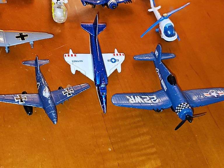 Toy vehicle grouping. Larger vehicles in the back are plastic, planes and General Lee cars or metal diecast.