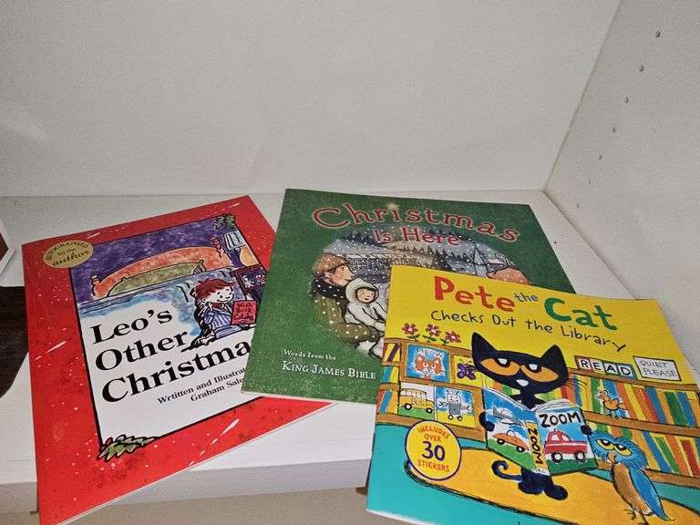 Grouping of children's books and a Bible verse.