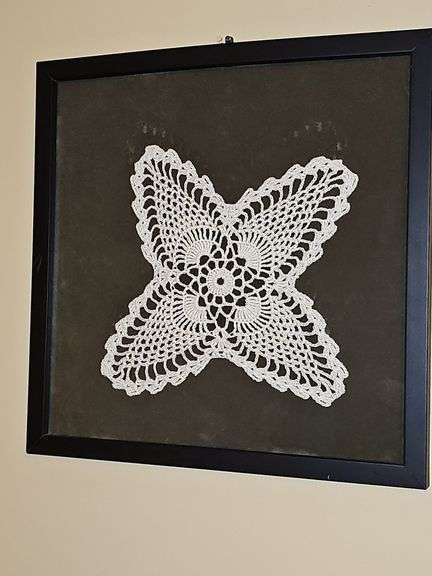 Framed hand crocheted doily. 13 x 13 in