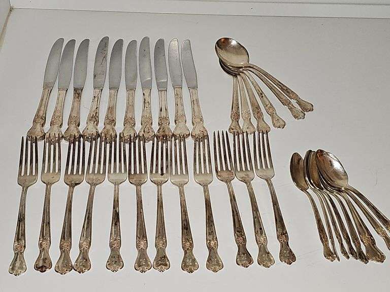 Old company plate flatware possibly Signature Rose pattern. 12 dinner forks, 10 dinner knives six soup spoons 9 teaspoons monogrammed H. Circa 1940s