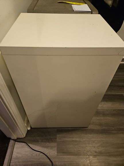 Three-drawer metal file cabinet...