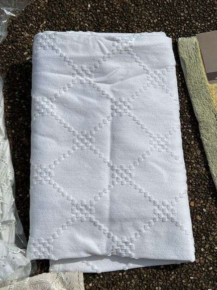 Wide variety of table linens and 1 new bath rug…..sizes unknown