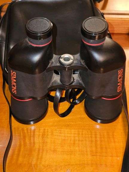 Simmons binoculars with lens caps and bag.