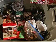Tub of decorative Christmas items.
