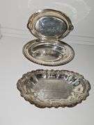 Silver plate bowls, covered dish, and trivets.