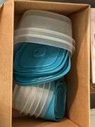 Tote full of miscellaneous household/kitchen items…..Food Network stemware, partial box of Rubbermaid storage containers, cutting boards and more