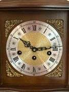 Vintage Franz Hermle & Sons Germany mantel clock with key and brass feet…..working condition….5820/4 on back….340-020 on workings….10-1/2 x 6-1/2 x 11 tall